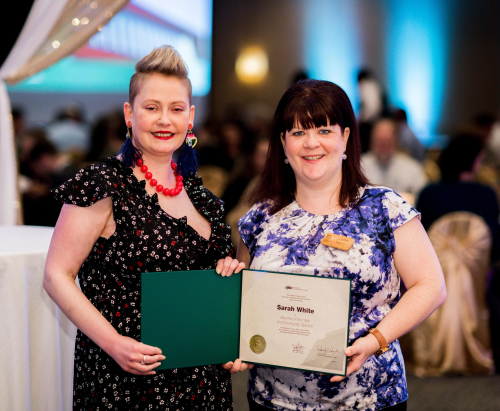 Distinguished Alumni Award winner Sarah White received the Community Service award from Jennifer Young, the UNBC Alumni Council President.
