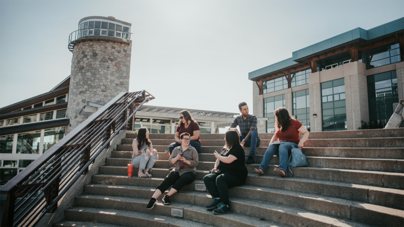 UNBC students sitting on stairs at Prince George campus