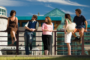 A picture of students leaning on a railing at the UNBC campus