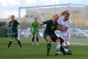 Kylie Erb (6) of the UNBC Timberwolves battles Danielle Fauteux (3) of the Thompson Rivers WolfPack for the ball during their Canada West women's soccer match on Sunday, Sept. 13, 2015. UNBC Communications photo.