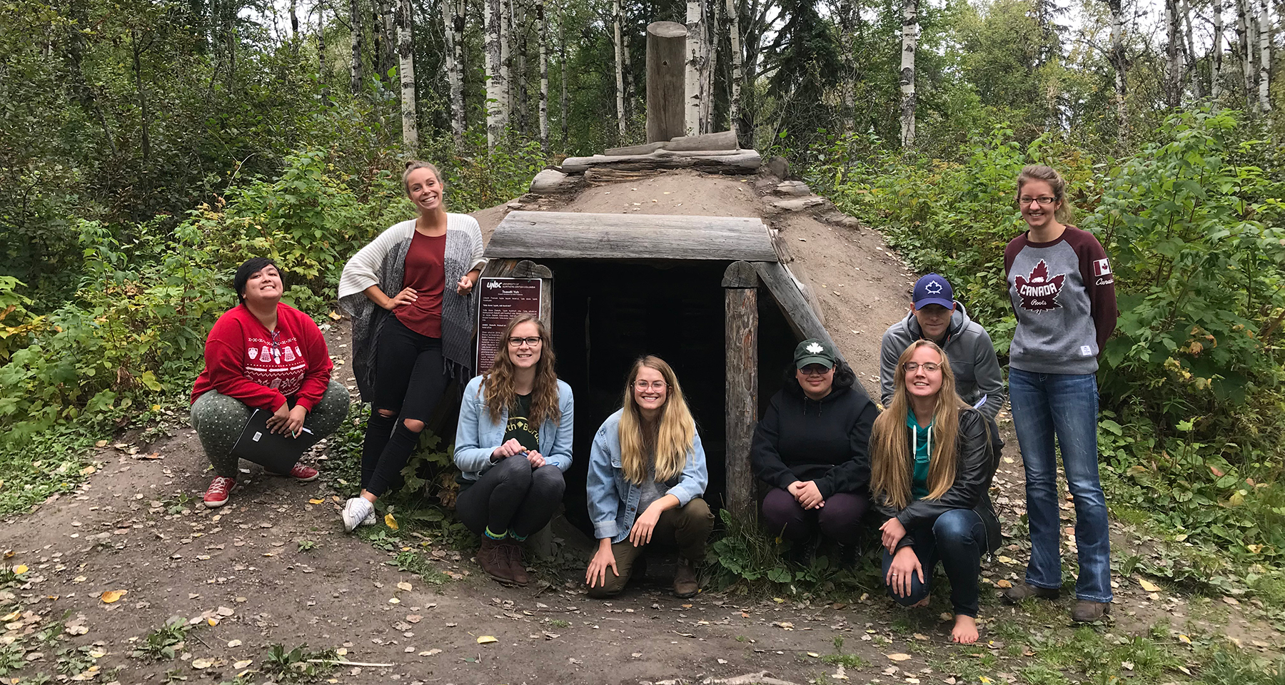 UNBC students at the pit house in Forest for the World
