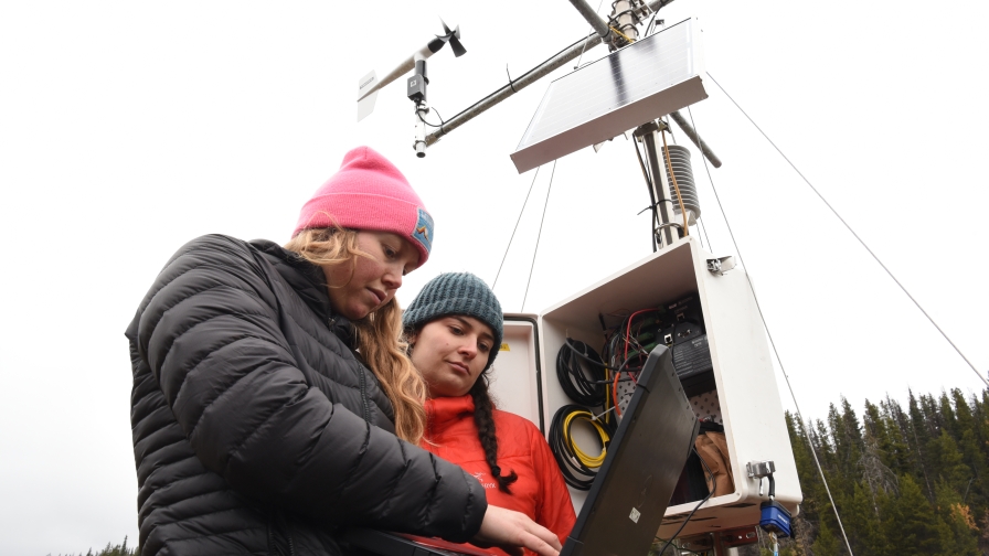 Research trainees work on weather monitoring equipment in north-central B.C. 
