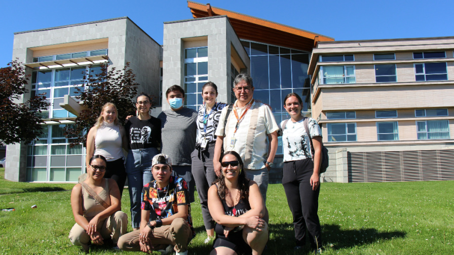 Indigenous students gathered together in front of Dr. Donald Rix building at UNBC.