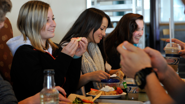students eating in the UNBC cafeteria