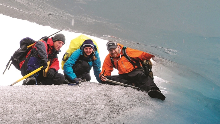 students exploring a glacier