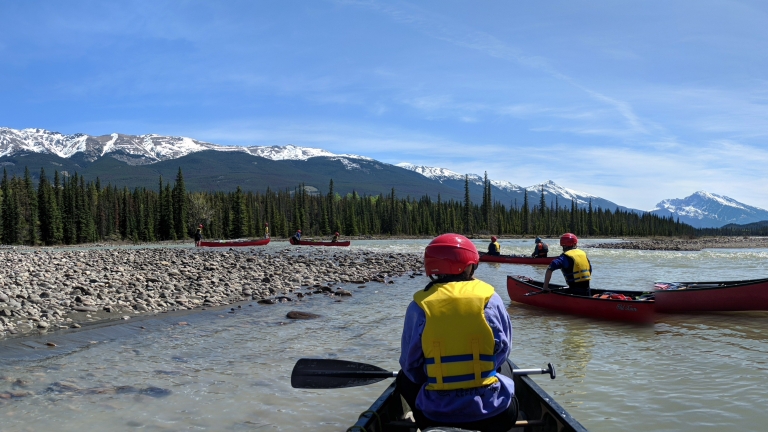 Nature-based Tourism Management students canoeing in river