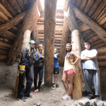 Some of the class in their completed pit house. 