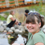A UNBC student relaxing with friends in the gardens.