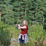 Student Krista Voogd enjoys a hobby on the shores of Shane Lake.