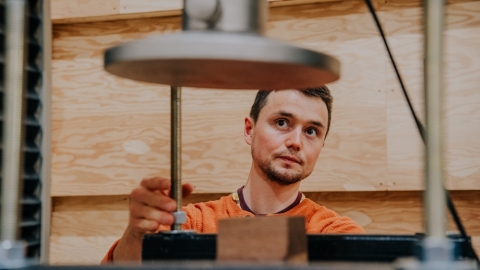A student conducts research at the Wood Innovation Research Lab